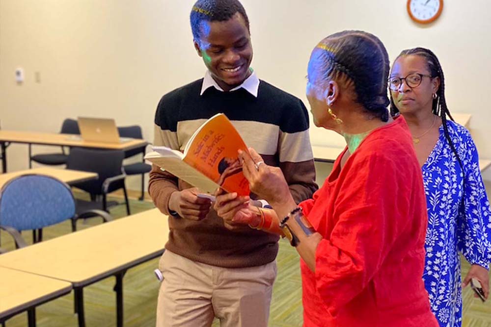 Two people discussion a book