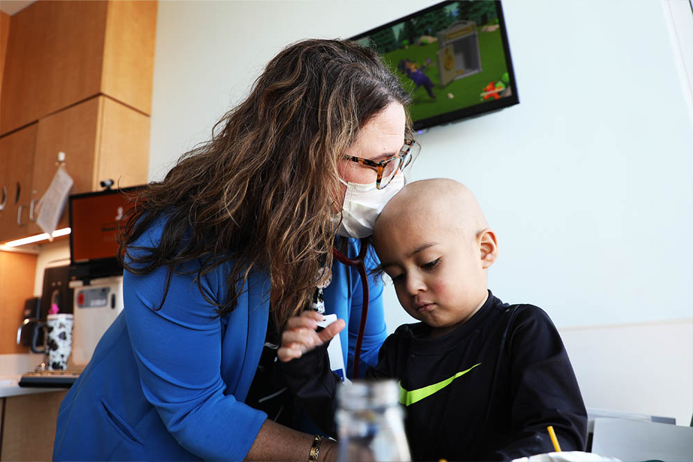 Murray kisses the top of her patient's head.