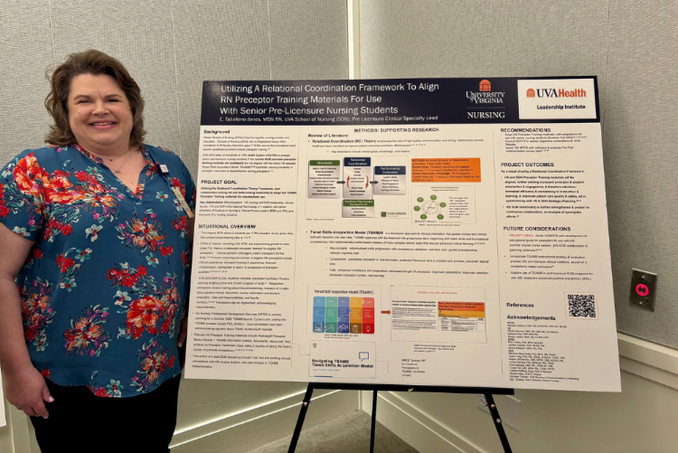 Elizabeth Taliaferro-Jones stands next to her capstone project poster