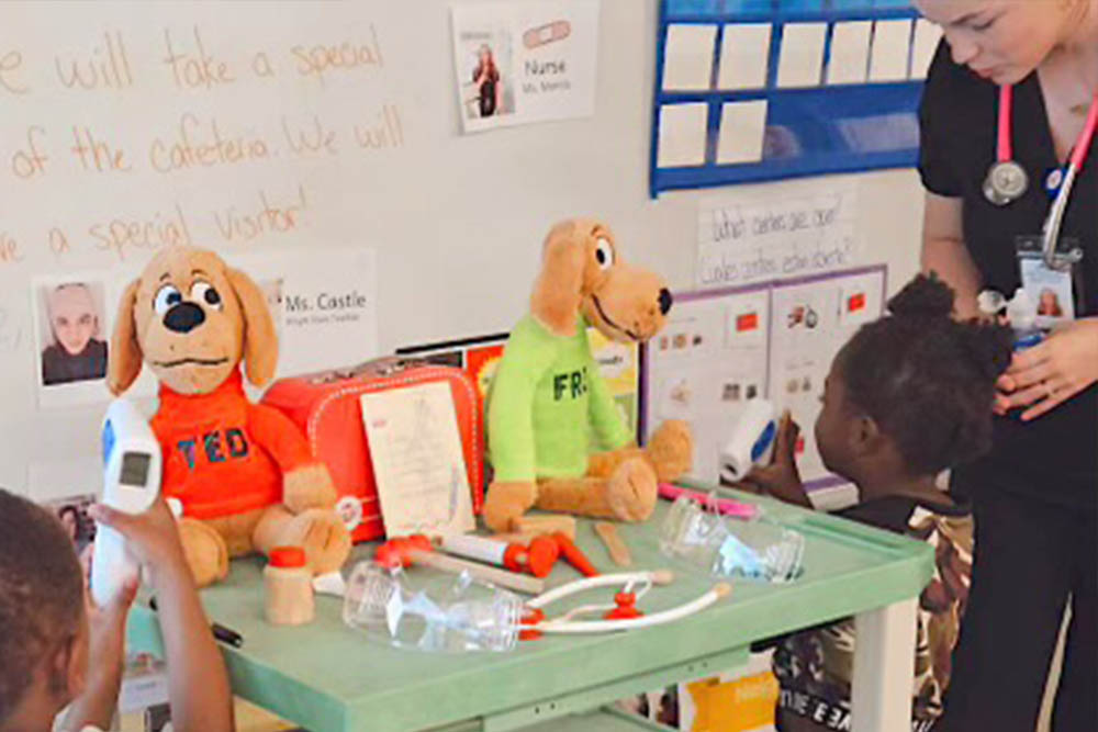 A school nurse with children