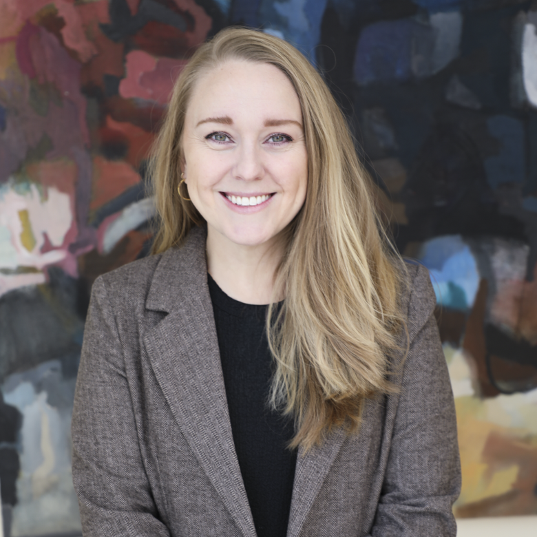 Jaimee Zawierucha, Marketing Manager, Blonde Woman with Green Eyes in Brown and Black Blazer