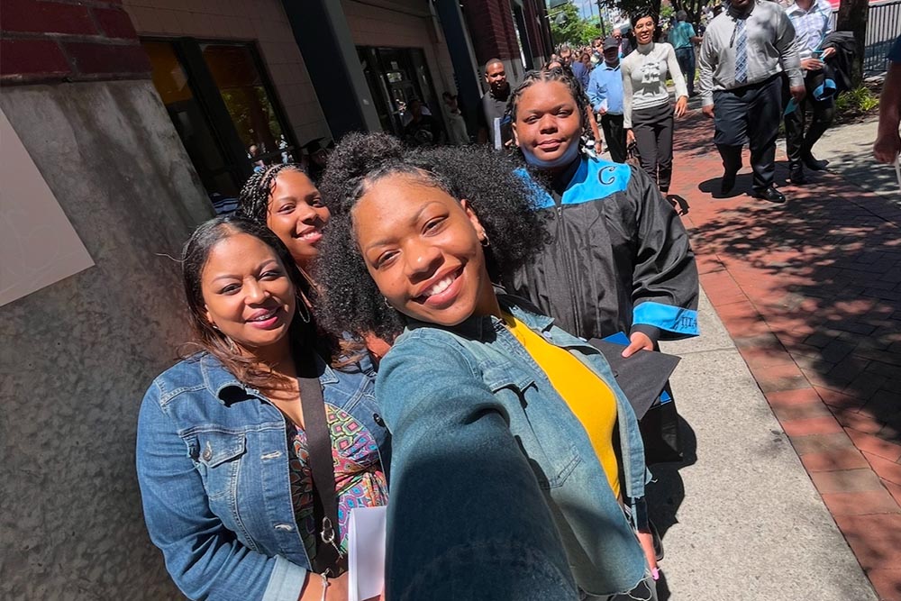 A selfie of a mom and her three children.