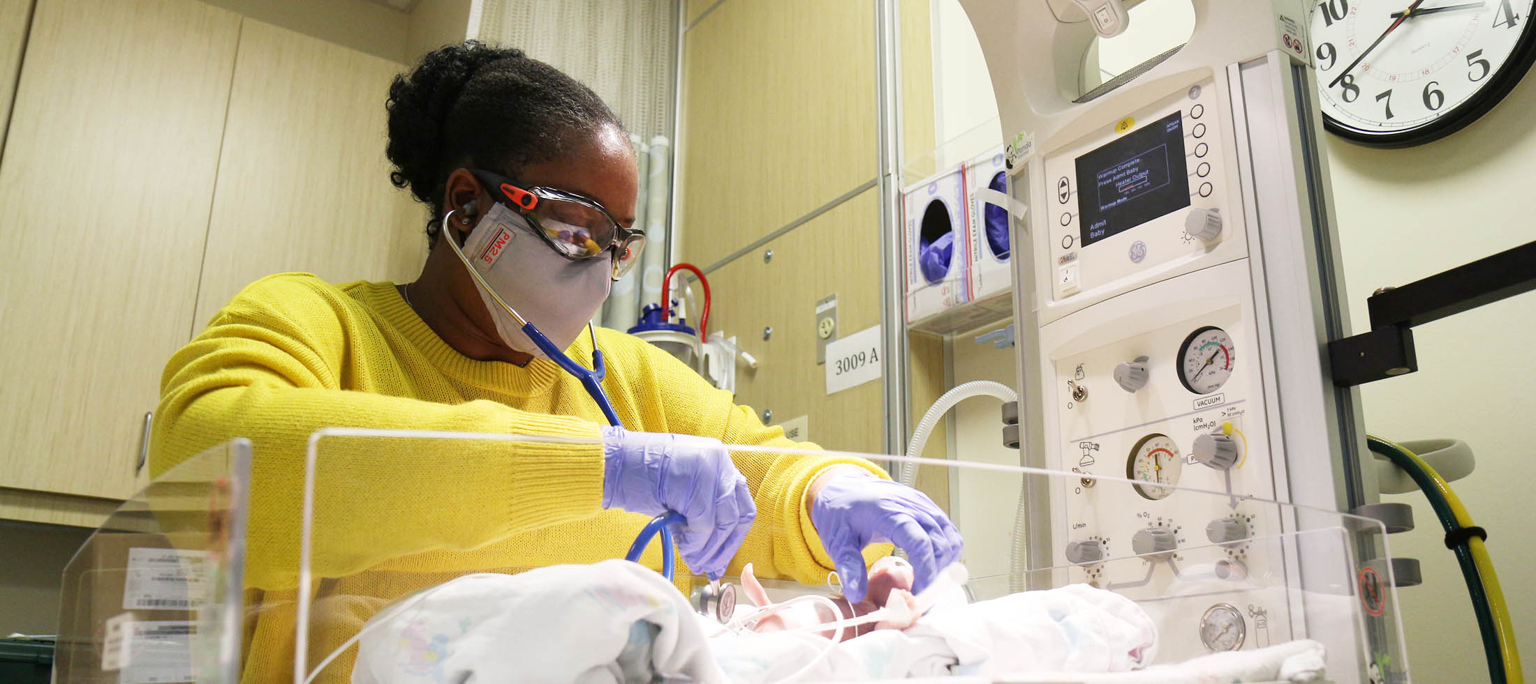 Neonatal nurse practitioner Tiffany Bittle tends a neonate