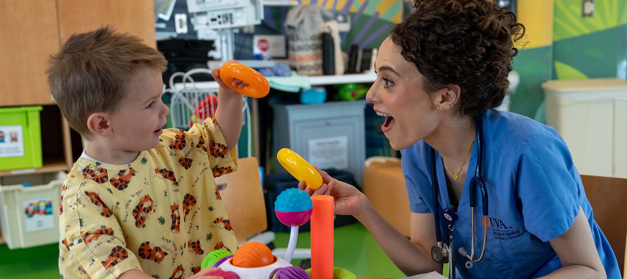 A nurse with a small child